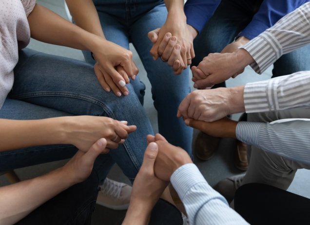 group of people holding hands